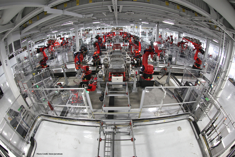 Tesla production line with red robots