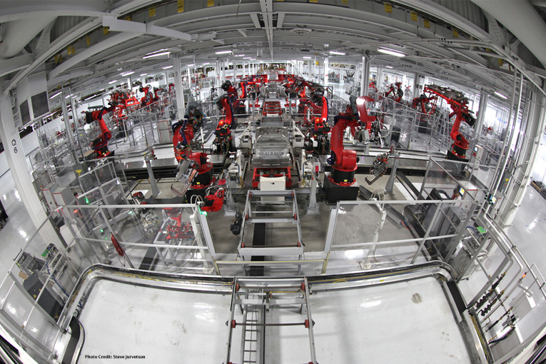 Tesla production line with red robots